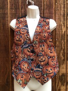 "Halloween size small tapestry vest with Jacko lantern print. Measurements taken across front laid flat 17.5\" across front armpit to armpit 18\" across waist 22\" length" Halloween Vest, Halloween Tapestry, Tapestry Vest, Core Fashion, Small Tapestry, Vintage Pumpkin, Black And Orange, Dec 30, Vest Outfits