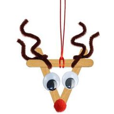 an ornament made to look like a reindeer with big eyes and horns hanging from a string