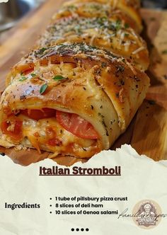 an italian stromboli on a wooden cutting board