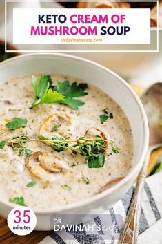 a white bowl filled with mushroom soup on top of a wooden table