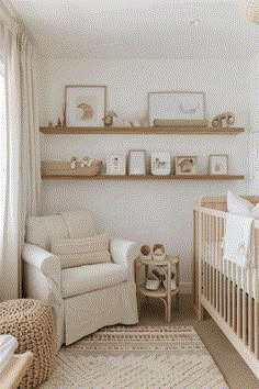 a baby's room is decorated in neutrals and whites