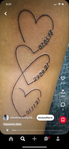 the back of a person's arm with two hearts on it and words written in cursive writing