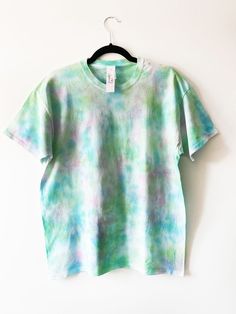 "Pastel Tie Dye, Multicolour T Shirt, Blue Pink Green, Custom T Shirt, Unique Tie Dye, Unisex, Short Sleeve, Soft Cotton, Tie Dye T Shirt Welcome to 102 Apparel! Your one stop shop for comfy and unique colourful clothing. -  Colour: Multicolour, Blue Green Pink  - Available in multicolour combinations - All products are completely unique - Dyes are vegan and cruelty free - Breathable fabric - 100% Cotton - Colour placement may vary due to being handmade - Size up for baggy fit - All products are made to order, so please allow 2-3 days for dispatch. - Please contact me for personalised colour requests. Manufacturer size guide (chest): - Please note we recommend sizing up. Please see below for women's sizing equivalent as provided from previous customer feedback.  S 36/37\"  M 38/40\"  L 41/ Pastel Crew Neck T-shirt For Summer, Pastel Crew Neck Top For Summer, Summer Pastel Crew Neck T-shirt, Summer Pastel Crew Neck Top, Colourful Clothing, Unique Tie Dye, Tie Dye Tops, Pastel Tie Dye, Unique Ties