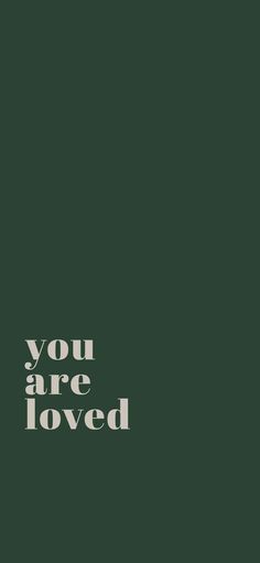 the words you are loved written in white on a dark green background