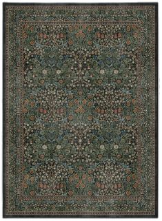 a green rug with an intricate design on the center and sides, surrounded by small flowers