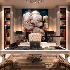 an office with a desk, chandelier and large floral painting on the wall