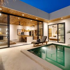 an indoor swimming pool in the middle of a house