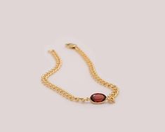 Material: Garnet + 14k Gold  Gemstone size: 4x5mm Oval Adjustable Chain Bracelet Gift, Oval Adjustable Chain Bracelet As Gift, Oval Chain Bracelet With Adjustable Chain As Gift, Oval Tarnish Resistant Bracelet As Gift, Tarnish Resistant Oval Bracelet As Gift, Oval Bracelet With Adjustable Chain As A Gift, Oval Yellow Gold Chain Bracelet Gift, Formal Oval Bracelets With Birthstone, Oval Link Gemstone Bracelet For Gift