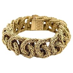 Estate Tiffany & Co. Vintage Braided Link Bracelet in 18K Yellow Gold. This rare bracelet features a hidden claps with a figure eight safety latch, is 7 3/8" long, 7/8" wide, and weighs 147.4 grams. Signed Tiffany & Co. 750 Italy and additional hallmarks. Tiffany And Co Bracelet, Louis Comfort Tiffany, Gold For Sale, Japan Design, Tiffany And Co, Vintage Bracelets, Cocktail Ring, Cocktail Rings, Tiffany & Co.