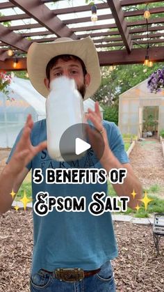 a man wearing a cowboy hat and drinking from a bottle with the words 5 benefits of epsom salt