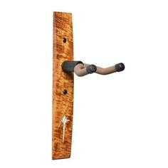 a wooden door handle with an iron cross on the front and back end, made out of wood