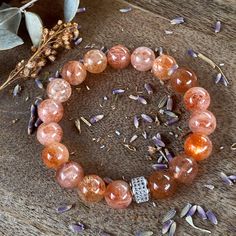 Sunstone gemstone bracelet bracelet. Beautiful 10mm Sunstone gemstone beads and Rhodium plated micro pave bead on elastic cord. Sunstone Bracelet, Pave Beads, Jade Bracelet, Amethyst Bracelet, Photo Bracelet, Micro Pave, Gemstone Bracelet, Beautiful Bracelet, Stones And Crystals