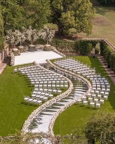 an aerial view of a wedding venue with rows of chairs set up for the ceremony