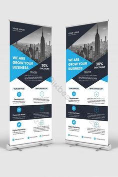 two roll up banners with blue and white shapes on the sides, one for business purposes