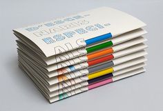 a stack of white paper with colored markers on it's sides and the words art asia printed on them