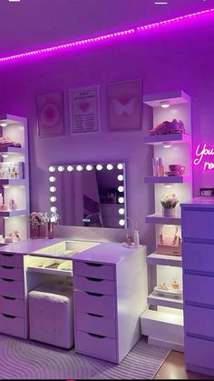 a room with purple lighting and white furniture