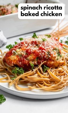 a white plate topped with spaghetti and meat covered in marinara sauce next to a casserole dish