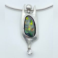 Stunning One Of A Kind Artisan Piece; Fiery Opal Flashing A Rainbow Of Colors, Set Within The Belly Of A Handmade Sterling Silver Organic Figure. Sparkling Cz Accent, Includes Lovely Quality Sterling Chain Necklace. Handmade Sterling Silver, A Rainbow, Womens Jewelry Necklace, Chain Necklace, Opal, Jewelry Necklaces, Sparkle, Women Jewelry, Pendant Necklace