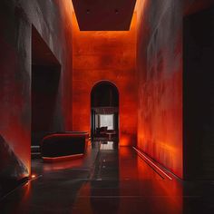 the hallway is lit up with red lights and black furniture, as well as an orange light