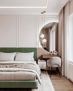 a bedroom with white walls and wood flooring has a green headboard on the bed