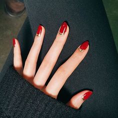 Make a red nail instantly more glamorous with a metallic accent. Start with a clear base coat and then paint your half moons in gold. Let dry, then fill in the rest of the nail in your favorite red polish. Finish with a topcoat. Red And Gold Nails, Nails Aesthetic, Nails Red, Super Nails, Red Nail