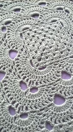 a crocheted doily with holes in the middle