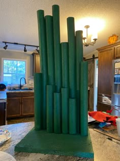 a green sculpture sitting on top of a kitchen counter