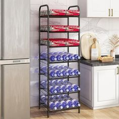 a metal shelf filled with lots of blue and red plates on top of a wooden floor