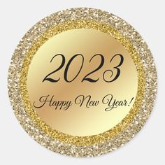 a happy new year sticker with gold glitter