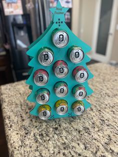 a christmas tree made out of cans on top of a counter