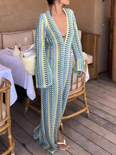 This elegant crochet maxi dress features a striking striped pattern and daring plunge neckline for a statement look. Lightweight, breathable fabric ensures comfort, while long sleeves add sophistication. Perfect for beach vacations or casual outings, this versatile dress is a summer wardrobe must-have. Beach dress styl Plunge Neck Maxi Dress, Fall Sweaters For Women, Elegant Crochet, Crop Pullover, Chic Maxi Dresses, Denim Hoodie, Jogger Pants Casual, Crochet Maxi Dress, Crochet Maxi