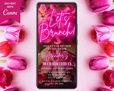 a cell phone with the text let's brunch on it next to pink tulips