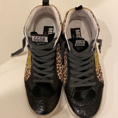 Unique Golden Goose Midstar ( Mid-Ankle High Top) With Cheetah Print And Gold Glitter Detail. Leather Toe Trim. Distressed Soles Part Of Original Design. Good Condition. Gold High-top Sneakers With Round Toe, Shoes Golden Goose, Goose Shoes, Golden Goose Shoes, Golden Goose, Cheetah Print, Gold Glitter, Womens Shoes Sneakers, High Top