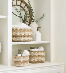 bathroom shelves with baskets and towels on them