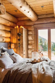 a bedroom with wooden walls and flooring