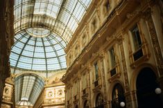 the inside of a building with glass ceiling