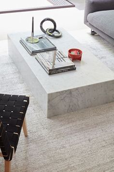 a living room with a marble coffee table