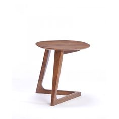 a small wooden table sitting on top of a white floor