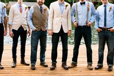 a group of men standing next to each other on a wooden floor near water and trees