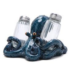 an octopus figurine sitting next to two water bottles