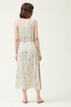 This stunning midi dress is a perfect blend of elegance and sophistication. The dress features a beautiful sage green satin fabric with a delicate floral print throughout. The sleeveless design keeps you cool and comfortable on warm days, while the asymmetric neckline adds a touch of modern flair. The dress falls to a midi length, which is both flattering and versatile. Asymmetric Neckline Dress, Green Satin Fabric, Asymmetrical Neckline Dress, Maxi Jumpsuit, Asymmetric Neckline, Neckline Dress, Swimwear Sets, Green Satin, Long Sleeve Midi