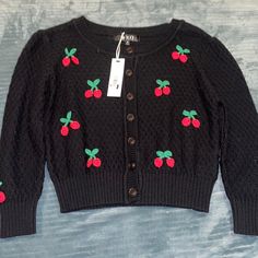 Women’s Button Up Sweater Black With Red Cherries Brand New With Tags Size M No Returns Black Cotton Cardigan With Buttons, Black Retro Cotton Cardigan, Vintage Black Cardigan With Button Closure, Black Fitted Button Sweater, Vintage Black Sweater With Buttons, Black Buttoned Spring Sweater, Black Buttoned Sweater For Spring, Cherry Sweater, Peplum Sweater