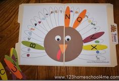 a paper turkey cut out to look like it is on the table with letters and numbers