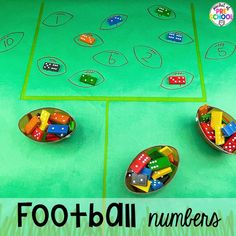 three bowls with dices and numbers in them sitting on a green surface, next to the words football numbers