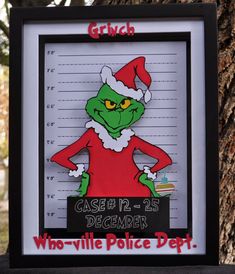 the grinch mug shot is displayed in front of a tree with writing that reads, who -ville police dept