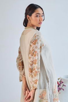 Grey full sleeves A-line kurta crafted in mul chanderi with floral handblock print, front inverted pleat and embroidered work on the V neckline. Paired with a pant and an inner. - Aza Fashions Cotton Silk Straight Kurta With Set-in Sleeves, Cotton Silk Kurta With Set-in Sleeves, Cotton Silk Kurta With Embroidered Sleeves, Long Sleeve Cotton Silk Kurta With Embroidered Sleeves, Bohemian Palazzo Set With Resham Embroidery And Long Sleeve, Festive Long Sleeve Kurta With Embroidered Sleeves, Eid Long Sleeve Blouse With Embroidered Sleeves, Traditional Long Sleeve Tunic With Embroidered Sleeves, Cotton Palazzo Set With Long Sleeves For Designer Wear