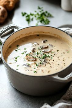 a pot filled with soup sitting on top of a table