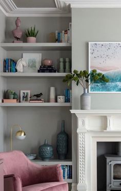 a living room filled with furniture and a fire place