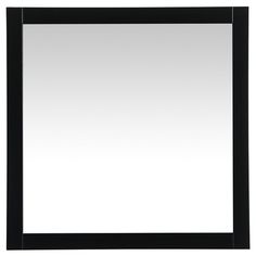 a black framed mirror on a white wall