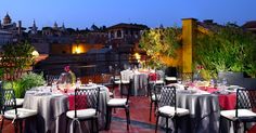 an outdoor dining area with tables and chairs